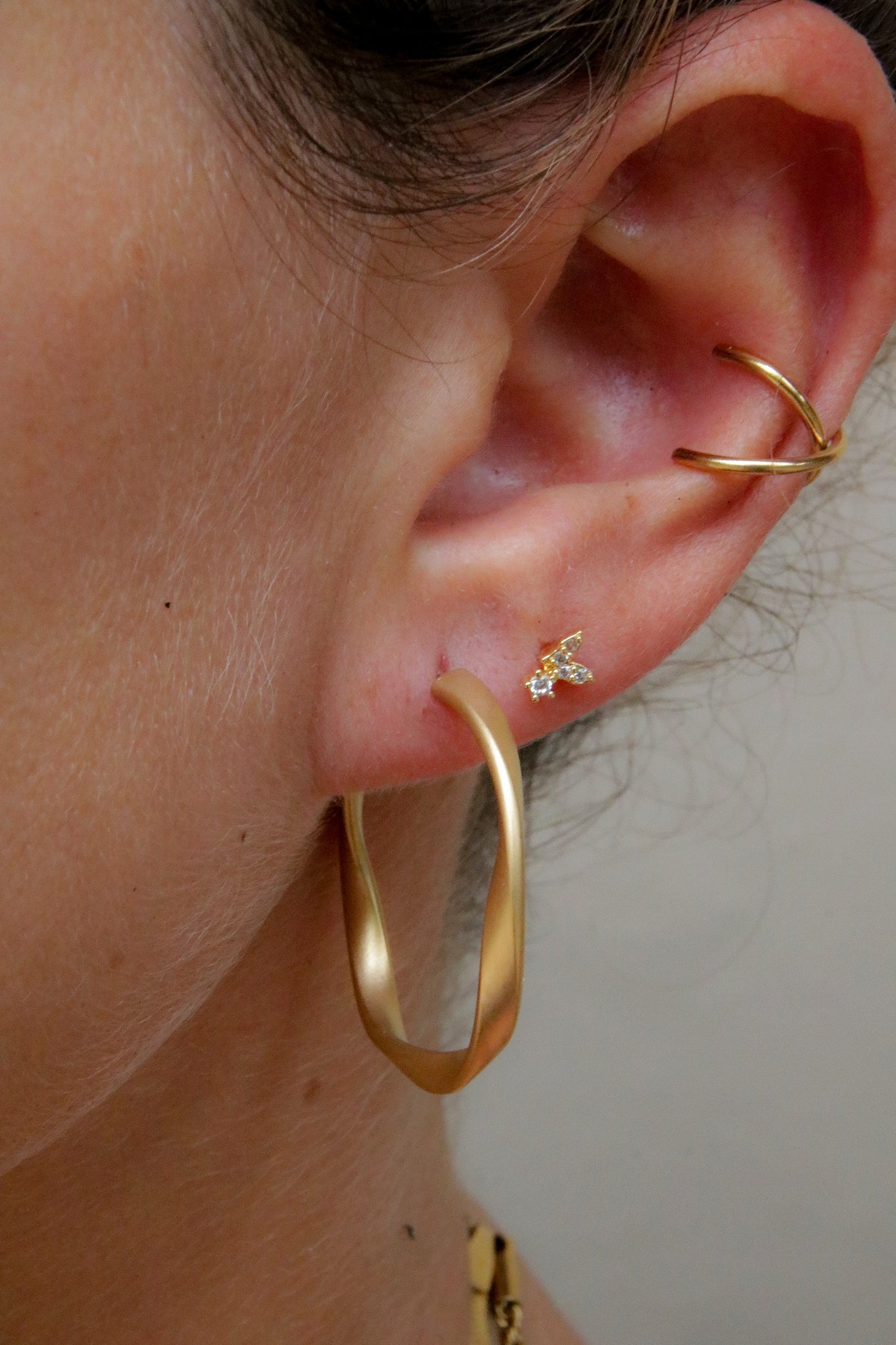 Boucles d'oreilles créoles Twist dorées